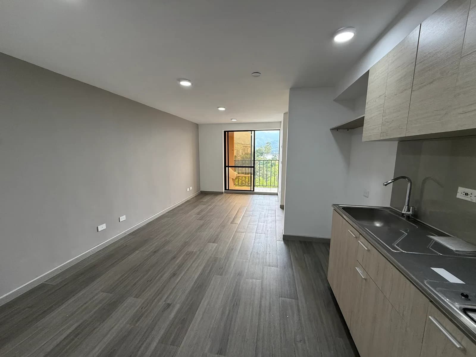 Sala y cocina del apartamento Hito 18, fotografía real